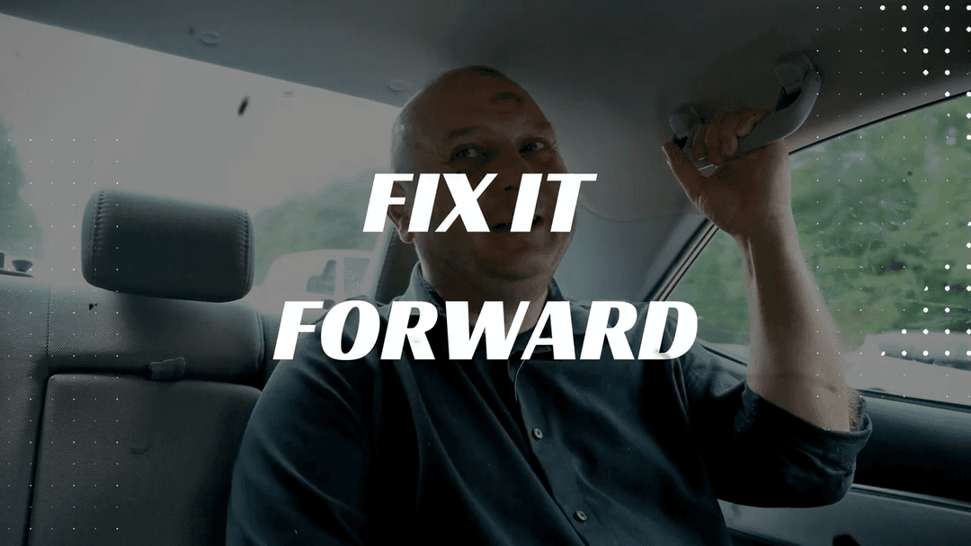 Bold white letters against a blurred image, reading "Fix It Forward."