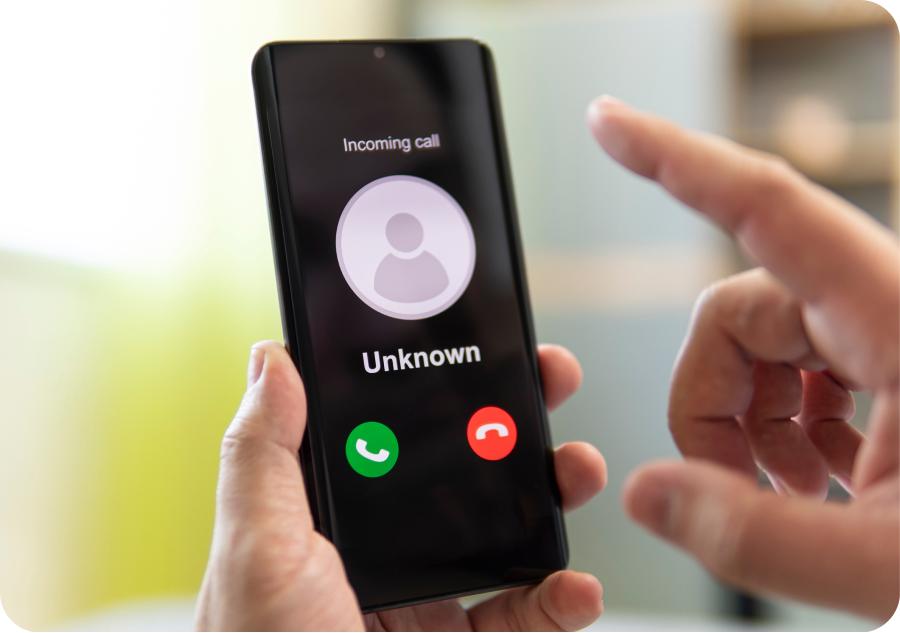 person pointing to phone with an unknown caller calling