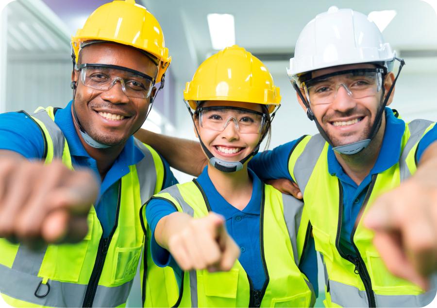 Three maintenance techs with hardhats pointing at the camera