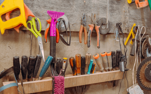 image of traditional tools on a wall